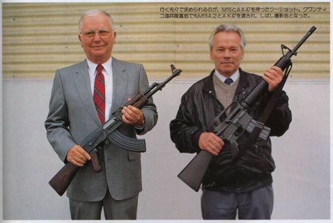 A picture of Eugene Stoner and Mikhail Kalashnikov, holding each other's weapons: The AK-47 and AR-15 respectively.